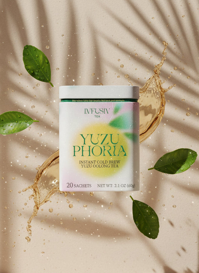 Yuzuphoria yuzu oolong instant cold brew tea package with yuzu slices and leaves on a beige background